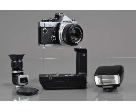 An Olympus OM-2n MD SLR Camera, shutter working, responsive in auto, meter responsive, self timer working, body G-VG, with Zu