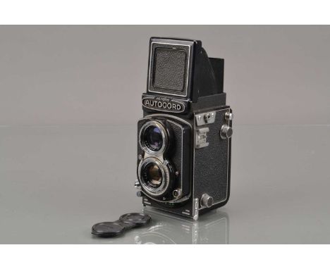 A Minolta Autocord RA TLR Camera, serial no 401824, shutter working, body G, some light wear to edges, with Rokkor 75mm f/3.5