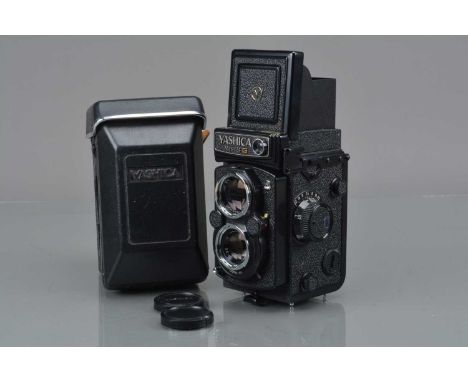 A Yashica Mat 124 G TLR Camera,  serial no 161214, shutter working, meter responsive, body VG, with Yashinon 80mm f/3.5 lens,