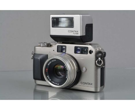 A Contax G1 Camera, green label, serial no 034909, shutter working, meter working, viewfinder display working, body G, some s