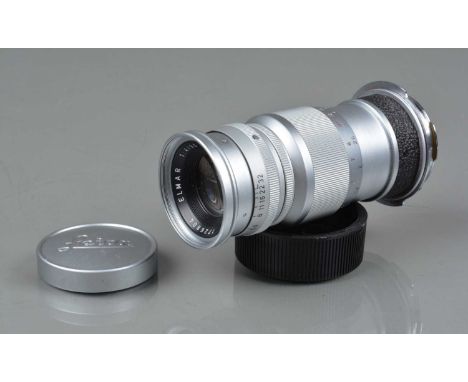 A Leitz Wetzlar 90mm f/4 Elmar Lens, L39 mount, with M mount adapter, serial no 1726804, 1960, barrel G-VG, elements G-VG, wi