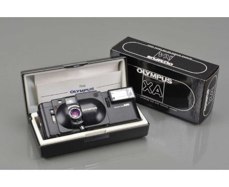 An Olympus XA Compact Camera, shutter working, meter responsive, self timer working, body G, elements G-VG, with A16 flash, f