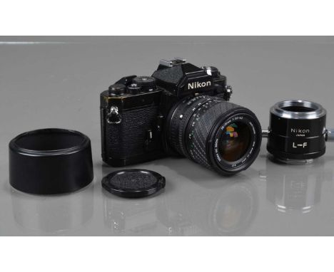 A Nikon FM SLR Camera, black, serial no 3104796, shutter working, meter responsive, self timer working, body G, some brassing