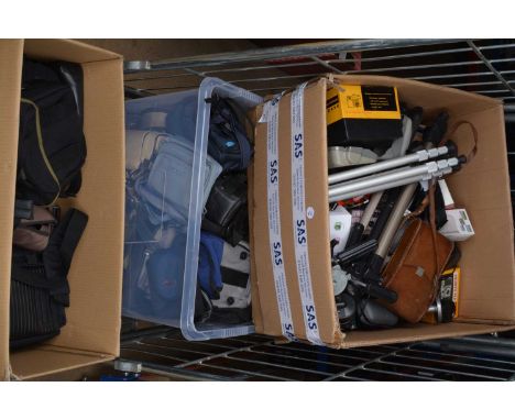 A Large Box of Camera Related Accessories,  including tripod heads, tripods, light meters, filters, flash units, caps, tubes,