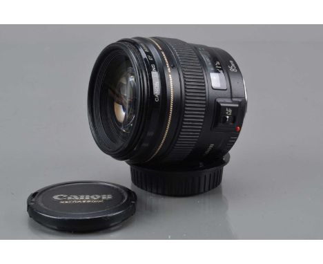 A Canon EF 85mm f/1.8 Ultrasonic Lens, auto focus functions, barrel G-VG, elements G-VG, with front and rear caps