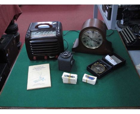G. Marconiphone serial No. 128776 bakelite radio, mahogany mantel clock, Ensign camera, cigarette cards. 1 Basket.