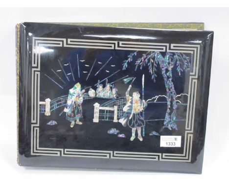 Oriental - Japanese Photo Album, the black lacquer cover inlaid with nacre and mother of pearl as warrior and figures, the in
