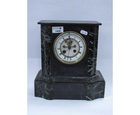 A XIX century black slate mantel clock with an enamel dial, shaped base.