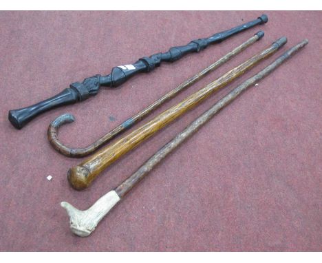 Early XX century walking stick with a white metal handle and band and another walking stick, carved african walking stick. (4