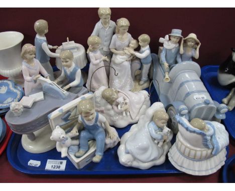 The Leonardo collection figurine to include a couple in vintage car, a family scene, piano lesson and two boy and girl sleepi