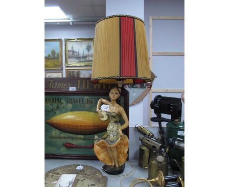 A vintage painted plaster table lamp as a mid XX century spanish lady holding a tamburine on a black base Reg No. 902917, 50c