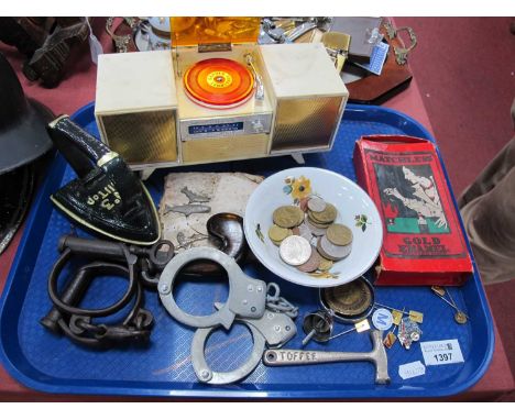 Hong Kong Radio as a Radiogram, 24cm wide, pistol hand cuffs, badges, etc:- One Tray