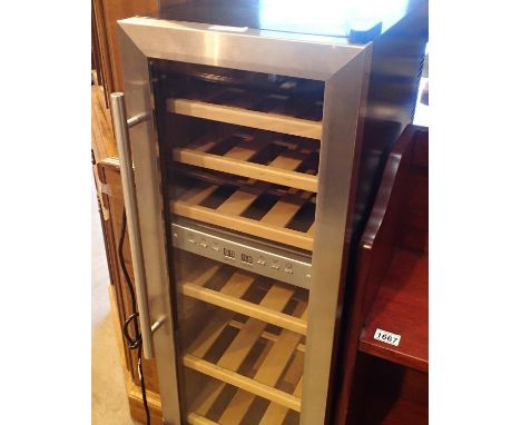 A glass fronted wine cooler fridge, 97 x 34 x 50 cm. Not available for in-house P&amp;P, contact Paul O'Hea at Mailboxes on 0