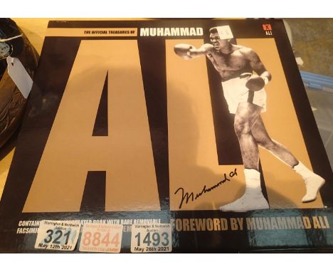 Mohammed Ali Official Treasures book in slip case. P&amp;P Group 1 (£14+VAT for the first lot and £1+VAT for subsequent lots)