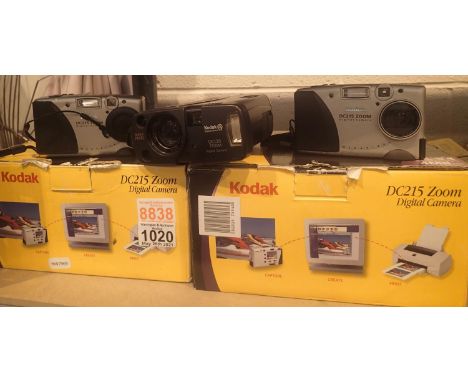 Three early Kodak digital cameras; 1 Kodak DC120 unboxed and 2 DC215 boxed and with accessories. P&amp;P Group 1 (£14+VAT for