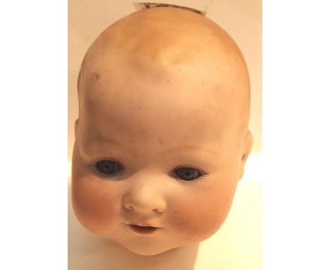 Vintage Armand Marseille bisque dolls head with moving eyes. P&amp;P Group 1 (£14+VAT for the first lot and £1+VAT for subseq