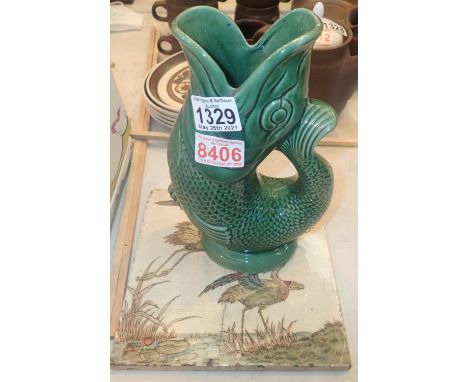 A green glaze gurgle fish jug and a ceramic tile depicting two birds. Not available for in-house P&amp;P, contact Paul O'Hea 