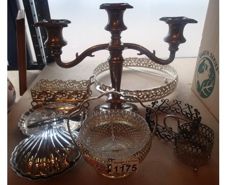 A silver plated candelabra and a selection of silver coloured items to include a single handed glass and metalware dish. Not 
