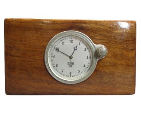 SMITHS AUTOMOBILE CLOCK - mounted within a polished wood block, 9cms clock diameter, 13 x 23 x 7cms overall