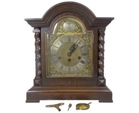 JUNGHANS OAK CASED MANTEL CLOCK - tempus fugit arched top dial set with Roman numerals before a pendulum driven chime strike 