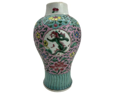 20th century Chinese Famille Rose baluster form jar, decorated with panels of Dragons, against a pink and scroll ground, H23c