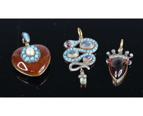 Three assorted pendants to include a yellow and white metal heart shaped pendant with reddish brown enamel detail and a centr