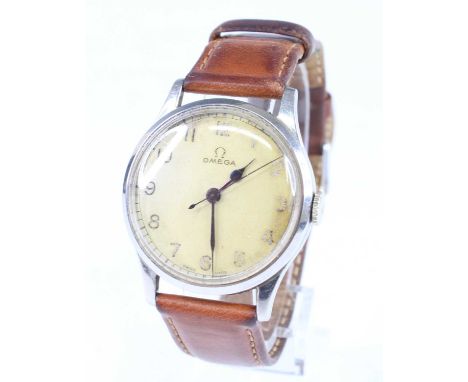 A vintage gent's Omega steel cased wristwatch, having signed white Arabic dial, manual wind movement, case dia.34mm, on leath