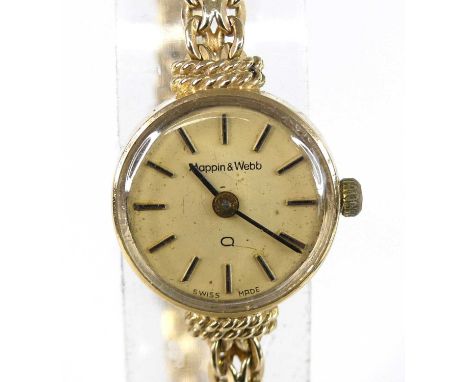 A 9ct yellow gold Mappin &amp; Webb quartz wristwatch, having a round cream baton dial and integral oval multi-link bracelet 