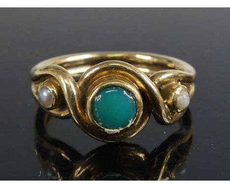 A 9ct yellow gold chrysoprase and pearl crossover style dress ring comprising a centre 4.9mm round chrysoprase with a 2.0mm h