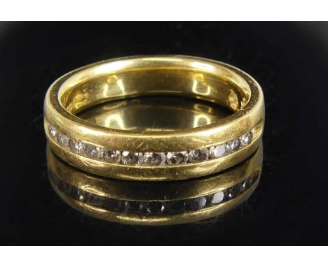 An 18ct yellow gold diamond half hoop eternity ring, having twelve round brilliant cut diamonds in channel settings, diamond 