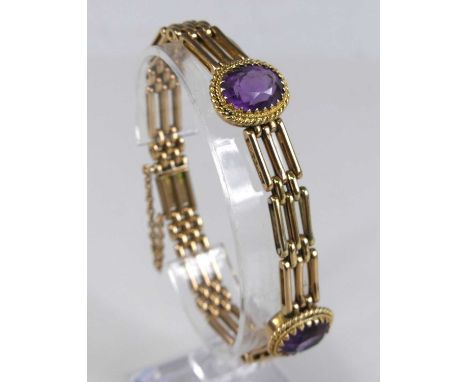 A Victorian style 9ct gold and amethyst set gate link bracelet, the twin oval cut amethyst each measuring approx 13.2 x 9.7 x