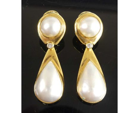 A pair of 18ct yellow gold pearl and diamond drop earrings, each comprising a 19.1 x 12.1mm pear shaped mabe cultured pearl s