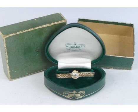 A vintage lady's Rolex Precision 9ct gold cased bracelet watch, having a signed silvered dial with baton markers, manual wind