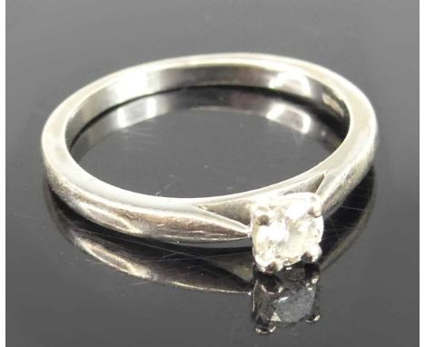 An 18ct white gold diamond solitaire ring, the four claw set round brilliant weighing approx 0.23ct, colour assessed as H, cl