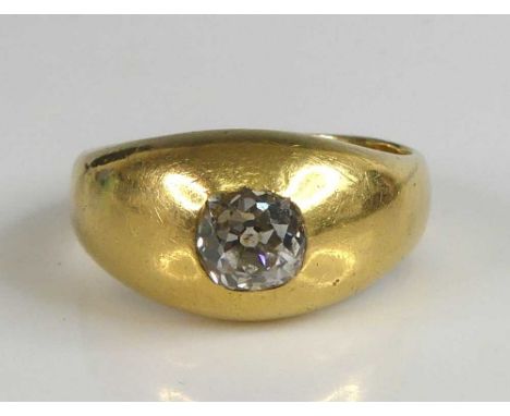 An 18ct yellow gold diamond solitaire ring, comprising an old mine cut diamond in a flush setting, diamond dimensions approx 