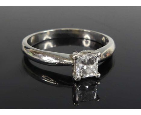 A modern platinum diamond solitaire ring, the four claw set princess cut diamond weighing 0.52ct, measuring 4.34 x 4.19 x 3.2