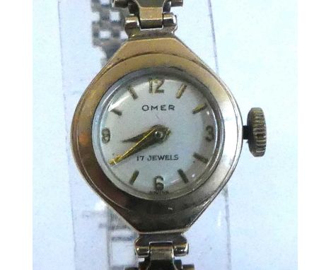 A lady's 9ct yellow gold Omer 17-jewel manual wind wristwatch, having a round cream quarter Arabic dial and fitted to a brick