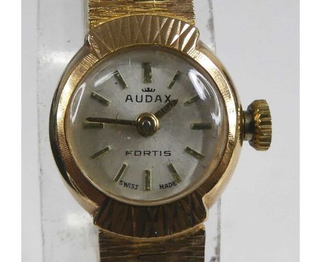 A lady's 9ct yellow gold Audax Fortis 17-jewel manual wind wristwatch, having a round cream baton dial and an integral bark f