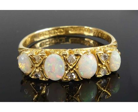 An 18ct yellow gold, opal and diamond half hoop eternity ring, featuring four graduated oval opal cabochons interspersed with