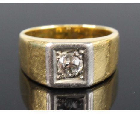 A yellow and white metal diamond set rectangular style signet ring, comprising an Old European cut diamond grain set, diamond