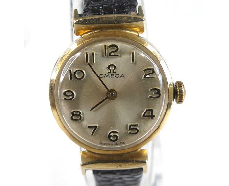 A lady's vintage Omega 9ct gold cased wristwatch, having a signed champagne Arabic dial, manual wind movement, the case with 