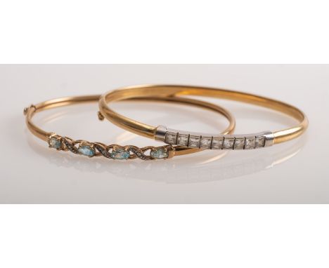 A gold bangle set with blue topaz  and another with synthetic stones, both 9ct, gross weight 9.4 grams  