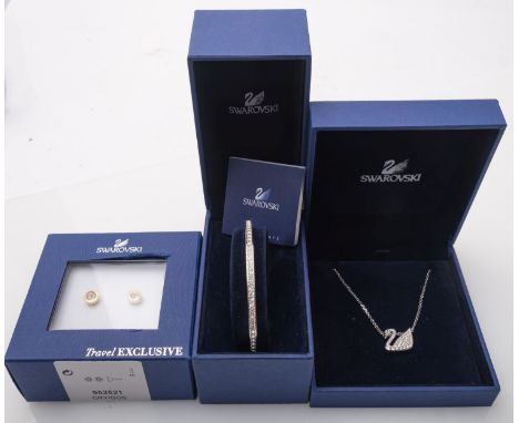 Swarovski crystal set bangle, swan pendant and earrings.   