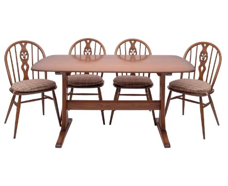 A stained elm dining table and four chairs en suite, by Ercol, circa 1970s; the rectangular top with shallow bowed sides, on 