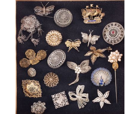 A group of filigree jewellery in silver and white metal, two filigree boxes and a brooch made from watch parts  