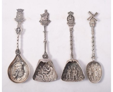 Four continental silver and silver plated caddy spoons:, with embossed and shaped bowls (4)
