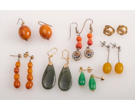  A group of earrings in amber, jade, micro mosaic with coral and others 