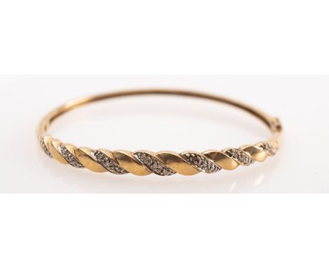 A 9ct  gold diamond bangle 

 Condition Report  gross weight 8 grams 