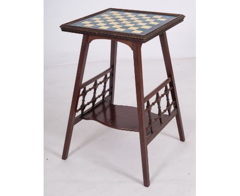 A mahogany and glazed ceramic tile inset games table in Arts & Crafts taste, early 20th century; 65cm high, the top 42cm squa