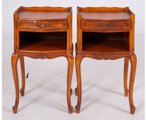 A pair of stained wood bedside stands in 18th century taste, modern; each with three-quarter gallery top above a drawer and a